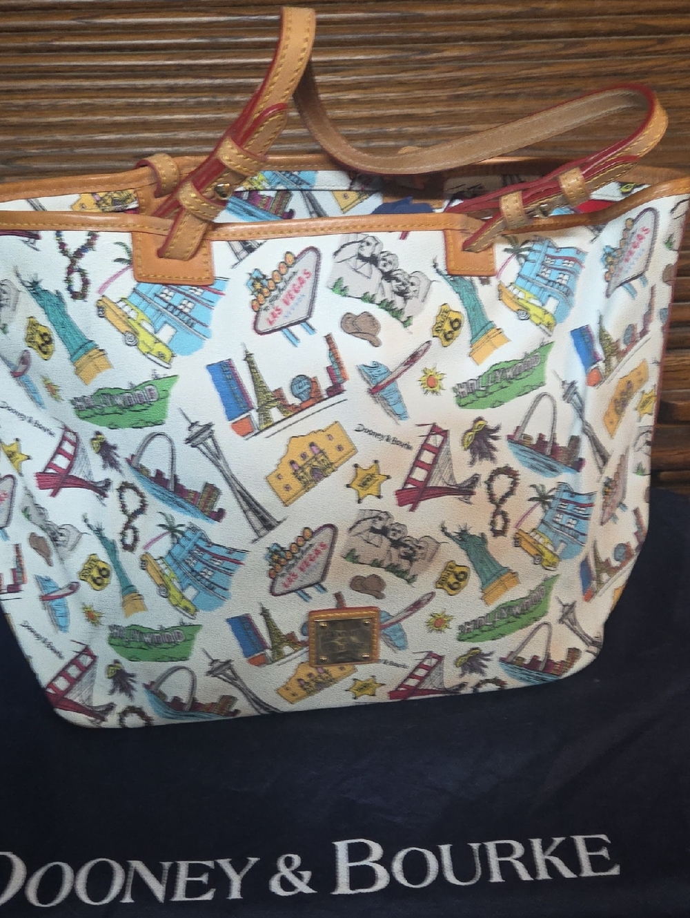 Dooney & Bourke White City-Print Tote with Tan Leather Trim and Red Accents